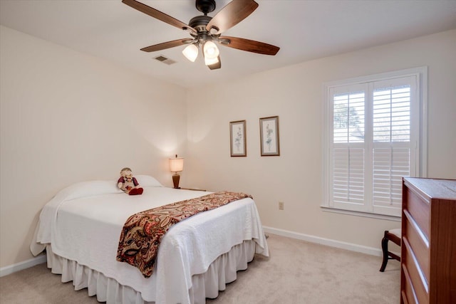 bedroom with light carpet and ceiling fan