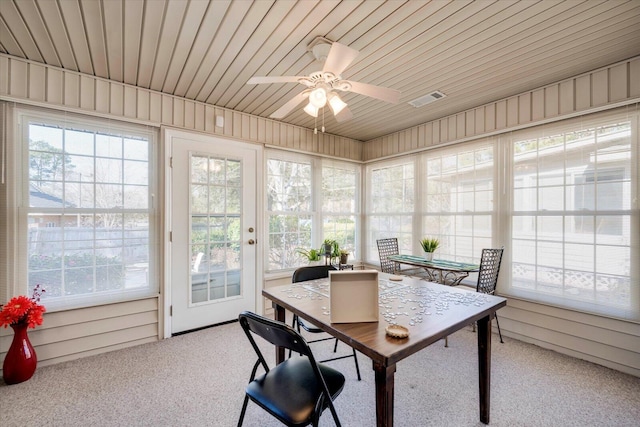 sunroom / solarium with ceiling fan and wooden ceiling