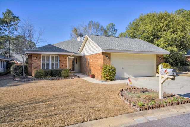 single story home featuring a front yard and a garage