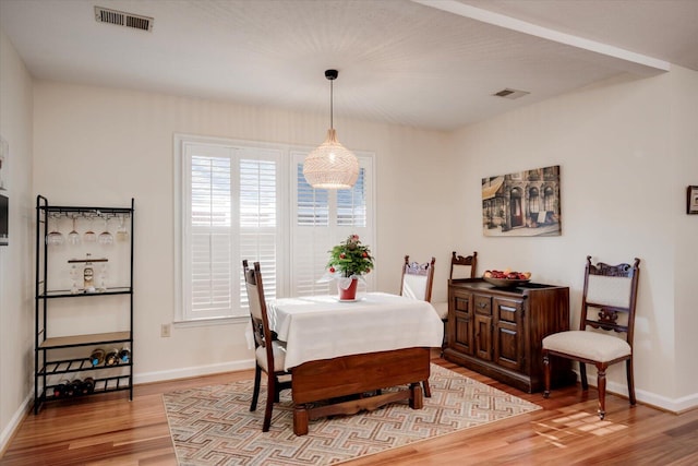 dining room with hardwood / wood-style flooring