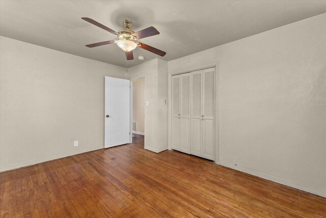 2216 Silverdale Rd, Augusta, GA 30906 - unfurnished bedroom featuring wood finished floors, a closet, ceiling fan, and baseboards