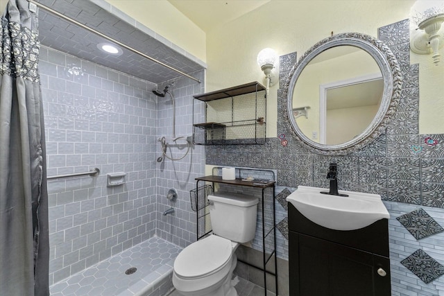 2216 Silverdale Rd, Augusta, GA 30906 - full bath featuring tiled shower, toilet, vanity, and tile walls
