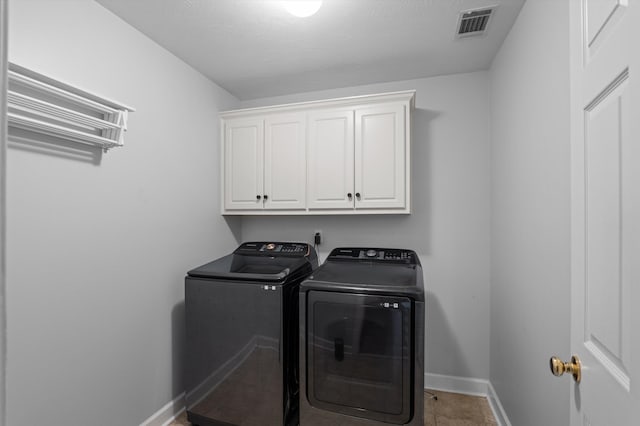 1382 Shadow Oak Dr, Evans, GA 30809 - laundry room with separate washer and dryer, cabinet space, baseboards, and tile patterned flooring
