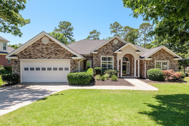 1382 Shadow Oak Dr, Evans, GA 30809 - view of front of property with an attached garage, a front yard, concrete driveway, brick siding, and roof with shingles