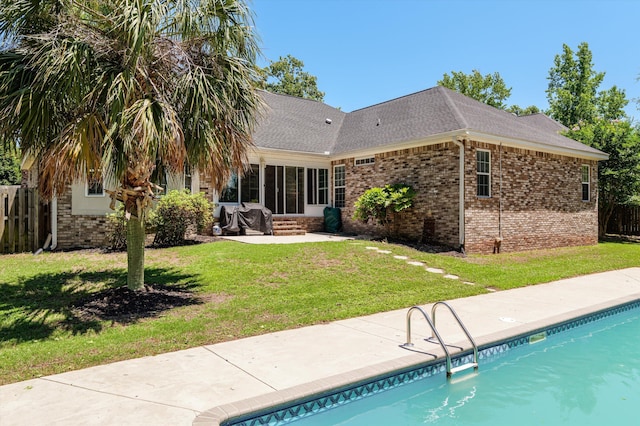 1382 Shadow Oak Dr, Evans, GA 30809 - back of property with brick siding, a patio area, an outdoor pool, roof with shingles, and entry steps