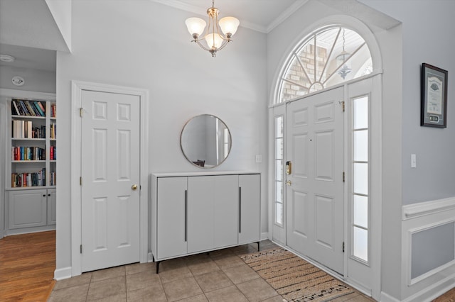 1382 Shadow Oak Dr, Evans, GA 30809 - entryway with crown molding, a chandelier, a high ceiling, and baseboards