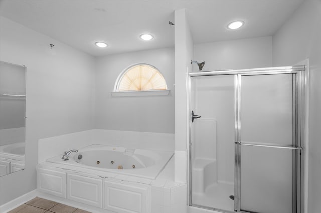 1382 Shadow Oak Dr, Evans, GA 30809 - full bathroom with a stall shower, a jetted tub, and tile patterned flooring
