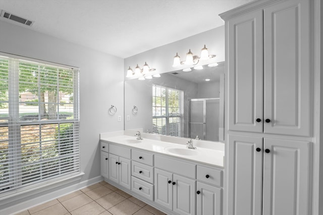 1382 Shadow Oak Dr, Evans, GA 30809 - bathroom with double vanity, a shower stall, tile patterned flooring, and baseboards