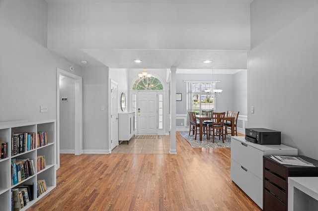1382 Shadow Oak Dr, Evans, GA 30809 - entrance foyer with a chandelier, light wood-style floors, and baseboards
