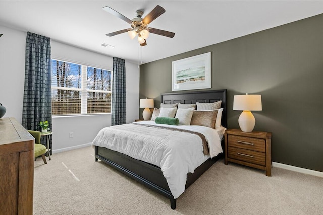 bedroom featuring light colored carpet and ceiling fan