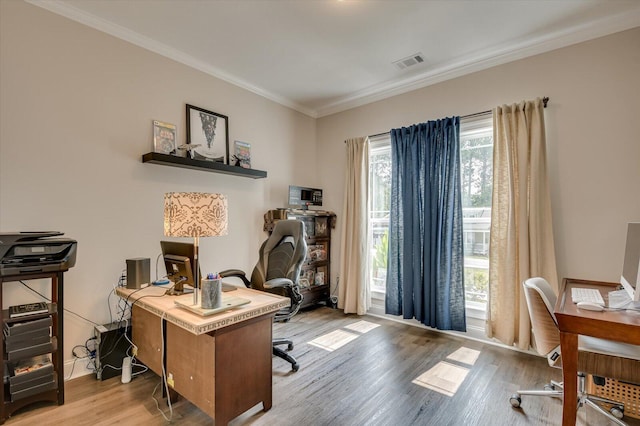 office space featuring light hardwood / wood-style flooring and ornamental molding