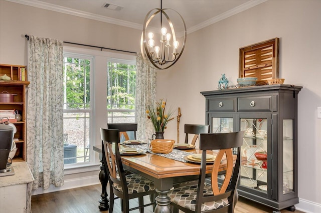 dining space with a healthy amount of sunlight, dark hardwood / wood-style flooring, and crown molding