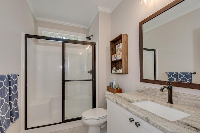 bathroom featuring tile patterned flooring, vanity, a shower with door, and ornamental molding