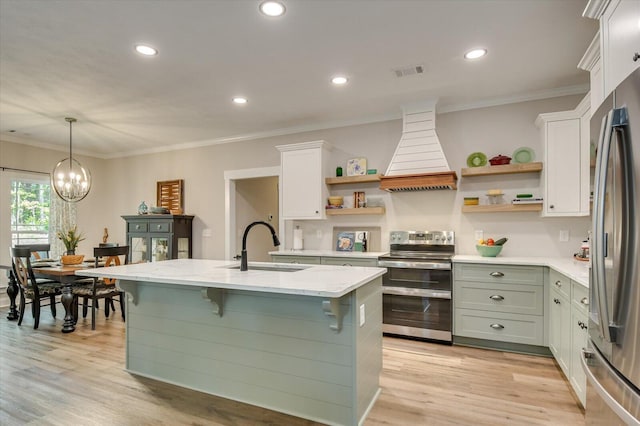 kitchen featuring white cabinetry, hanging light fixtures, stainless steel appliances, a chandelier, and custom range hood