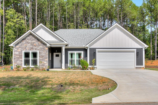 craftsman house with a front lawn and a garage