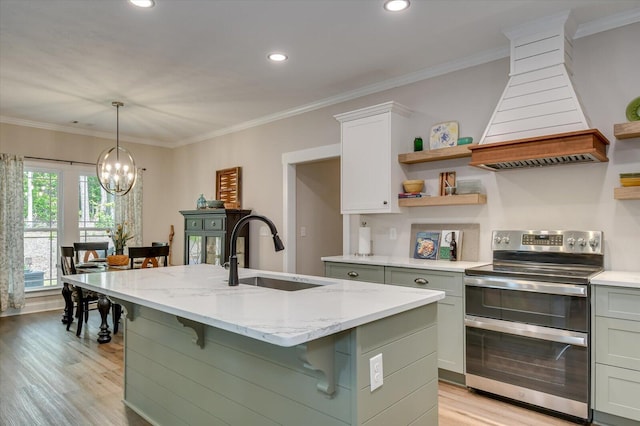 kitchen featuring a kitchen island with sink, sink, electric range, light stone counters, and white cabinetry