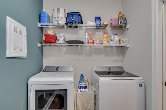 clothes washing area featuring independent washer and dryer