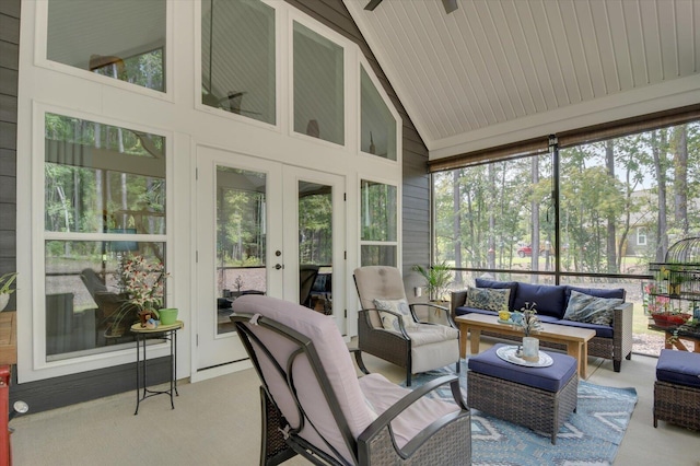 sunroom / solarium with french doors, vaulted ceiling, and ceiling fan