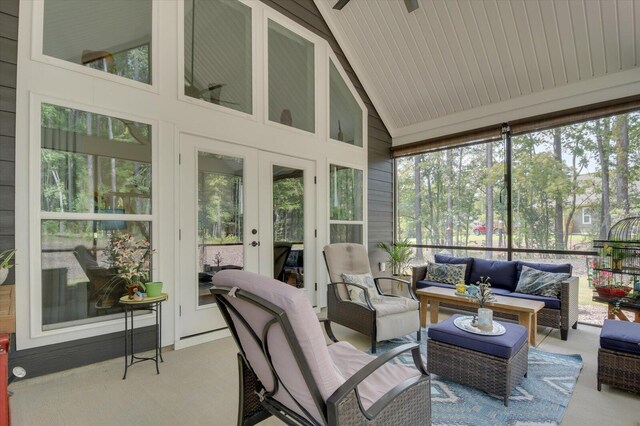 sunroom / solarium with french doors, vaulted ceiling, and ceiling fan