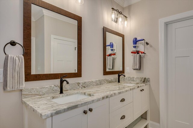 bathroom with vanity and crown molding