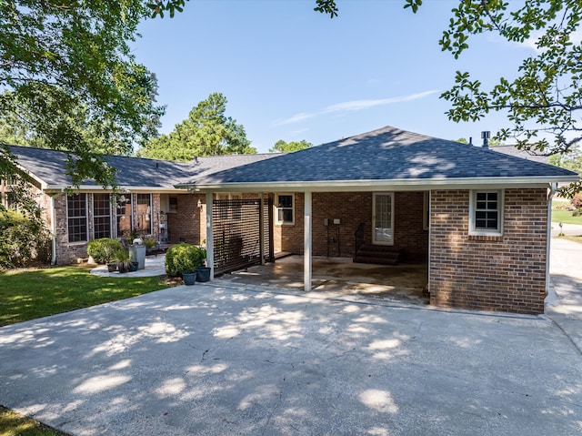 3076 Westwood Rd, Augusta, GA 30909 - single story home with a carport, driveway, brick siding, and a shingled roof