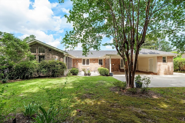 3076 Westwood Rd, Augusta, GA 30909 - single story home featuring a carport, a front yard, brick siding, and concrete driveway