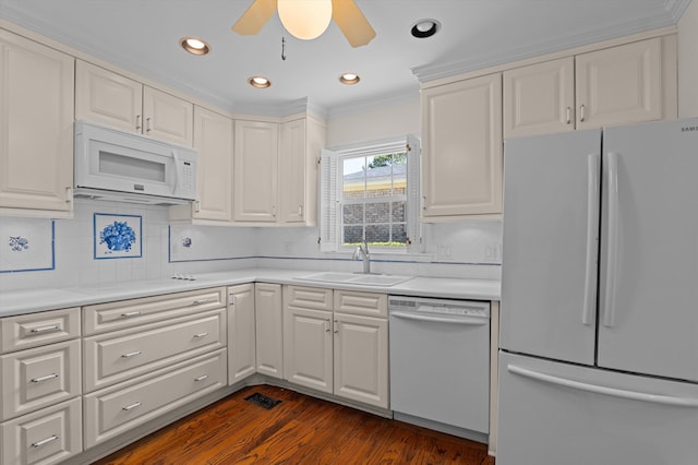 3076 Westwood Rd, Augusta, GA 30909 - kitchen with white appliances, white cabinets, light countertops, dark wood-style flooring, and crown molding