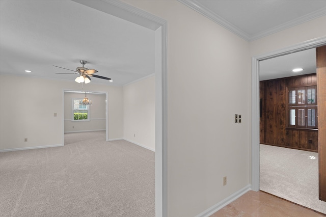 3076 Westwood Rd, Augusta, GA 30909 - unfurnished room with ceiling fan, a chandelier, light carpet, crown molding, and wooden walls