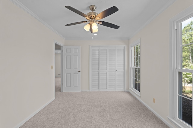 3076 Westwood Rd, Augusta, GA 30909 - unfurnished bedroom featuring ornamental molding, carpet flooring, multiple windows, a closet, and ceiling fan