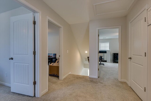 corridor with light colored carpet