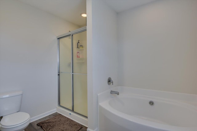 bathroom with plus walk in shower, wood-type flooring, and toilet