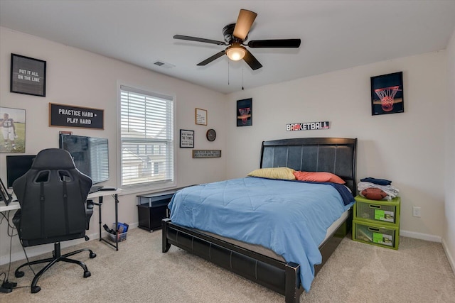 bedroom with light carpet and ceiling fan