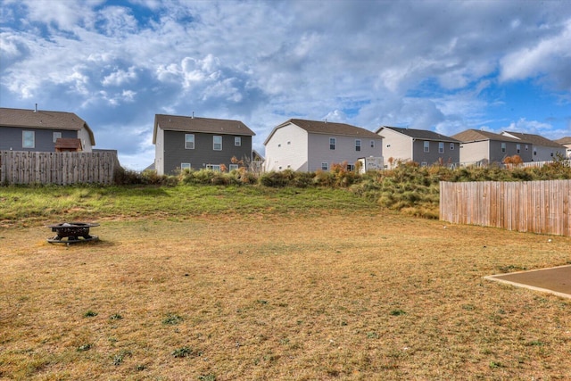 view of yard featuring an outdoor fire pit