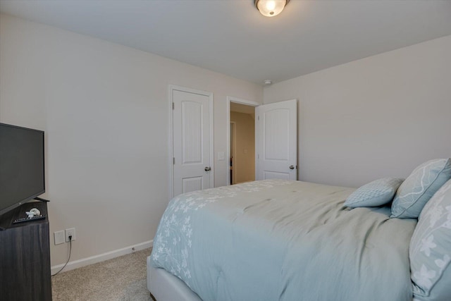 bedroom with light colored carpet