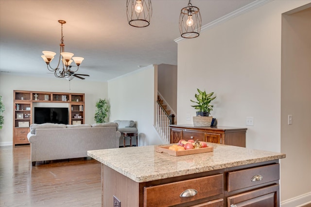 867 Williford Run Dr, Grovetown, GA 30813 - kitchen featuring a chandelier, wood finished floors, pendant lighting, ornamental molding, and baseboards