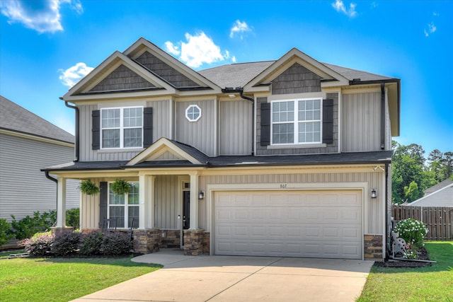 867 Williford Run Dr, Grovetown, GA 30813 - craftsman house with stone siding, board and batten siding, driveway, an attached garage, and a porch