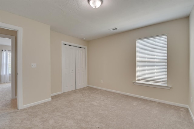 867 Williford Run Dr, Grovetown, GA 30813 - unfurnished bedroom featuring light colored carpet, baseboards, and a closet