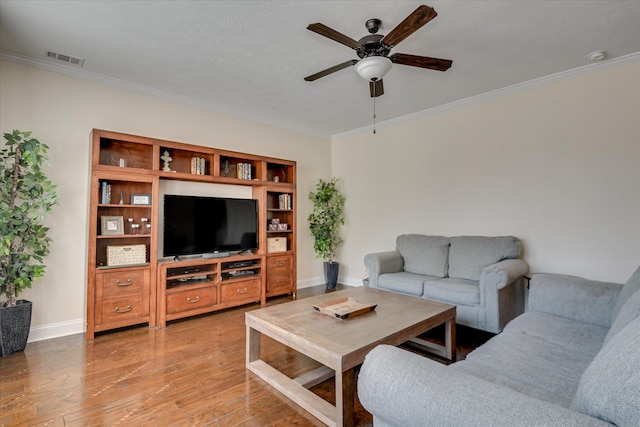 867 Williford Run Dr, Grovetown, GA 30813 - living area with ornamental molding, ceiling fan, light wood-style floors, and baseboards