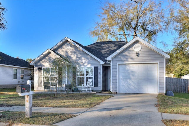 single story home with a garage and a front lawn