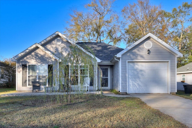 single story home featuring a front lawn and a garage