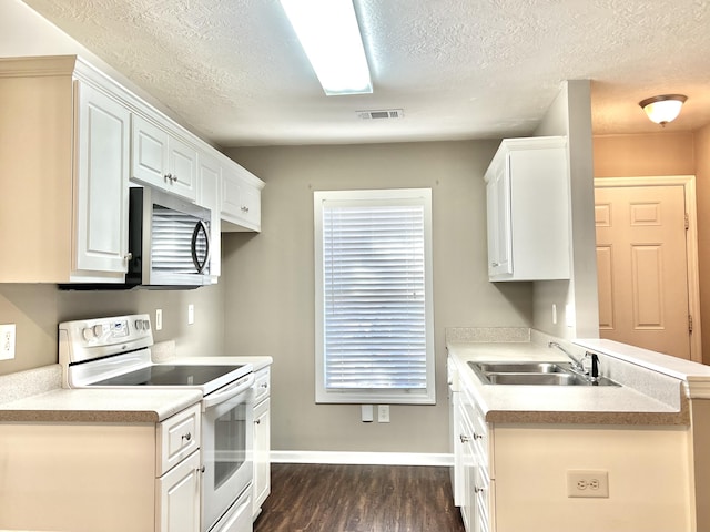 kitchen with white cabinetry, sink, white electric range oven, dark hardwood / wood-style floors, and a textured ceiling