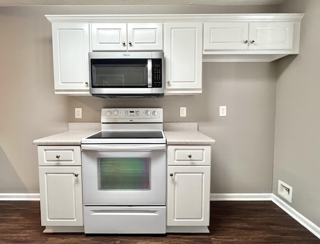 kitchen featuring electric stove, white cabinets, and dark hardwood / wood-style floors