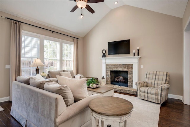 living area featuring high vaulted ceiling, a fireplace, a ceiling fan, baseboards, and dark wood finished floors