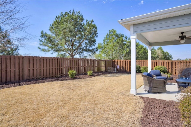 view of yard featuring ceiling fan, a patio, and a fenced backyard