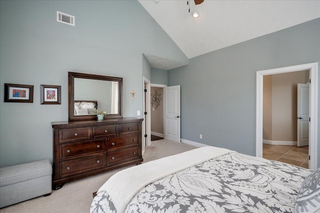 bedroom with visible vents, light carpet, and baseboards