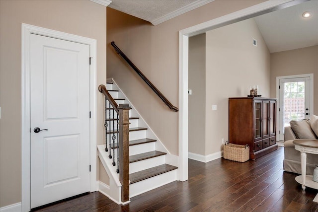 stairway featuring recessed lighting, wood finished floors, visible vents, and baseboards