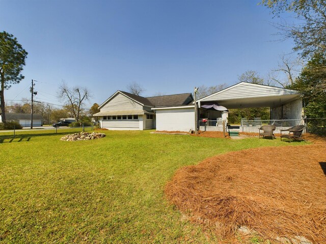 102 Ellis St, Wrens, GA 30833 - view of front of property with a garage, a front yard, and a carport