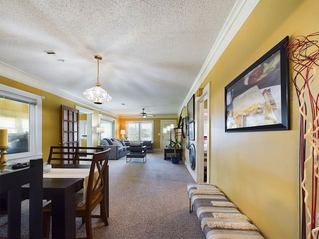 102 Ellis St, Wrens, GA 30833 - dining area featuring ceiling fan, crown molding, and a textured ceiling