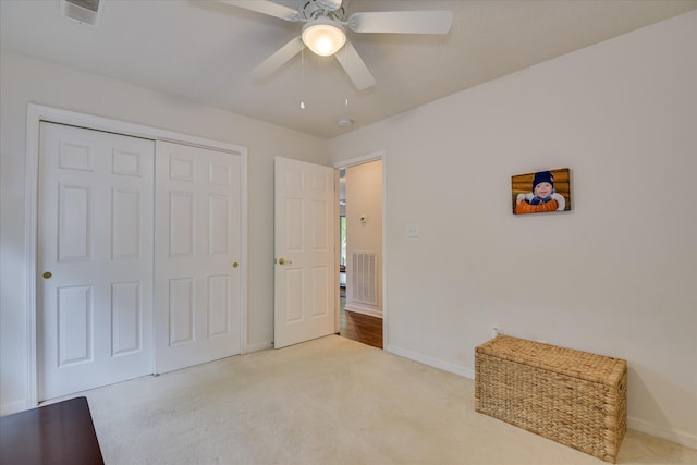 212 Links Pl, Mccormick, SC 29835 - unfurnished bedroom featuring baseboards, light colored carpet, a closet, and a ceiling fan
