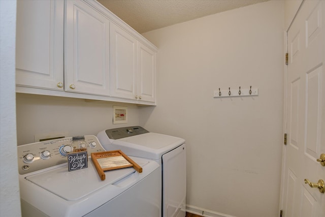 212 Links Pl, Mccormick, SC 29835 - laundry room with separate washer and dryer, cabinet space, baseboards, and a textured ceiling